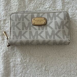 SOLD OUT!  
Michael Kors Monogrammed Cream Wallet